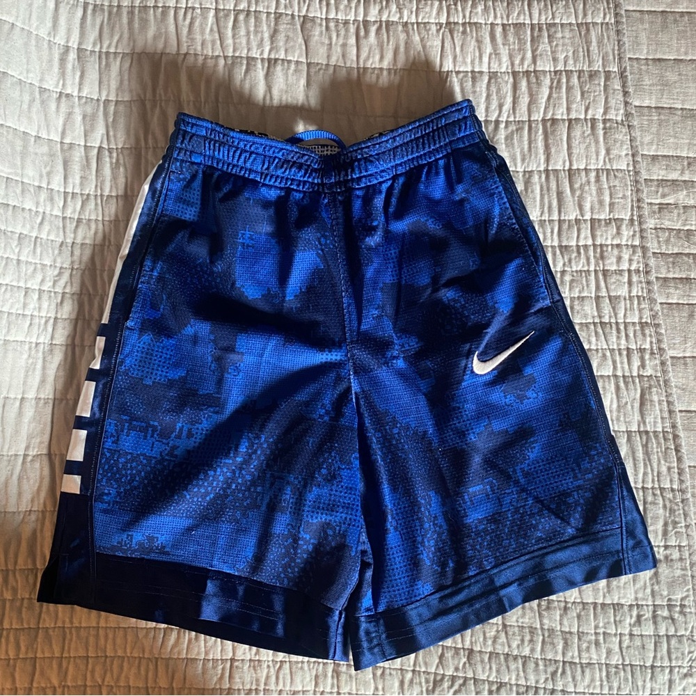 Boys royal blue Nike shorts.